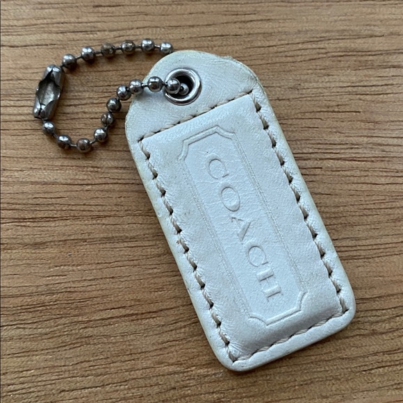 Coach Handbags - Coach charm white silver tone color in good condition